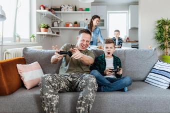 Father and son playing video games