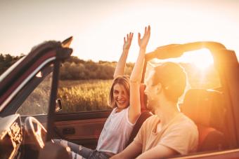 Romantic moments in sunset on a road trip