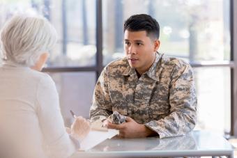 Soldier talks with mental health professional 