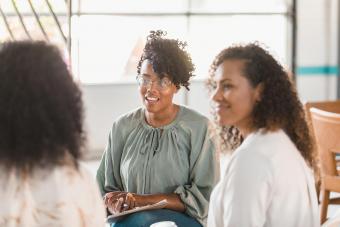 woman shares during group therapy