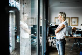 modern businesswoman standing in her office