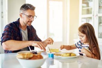 father and daughter having a meal together