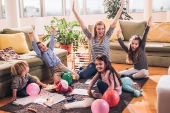 happy woman having fun with small kids