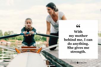 mother teaching daughter to competitive row boat