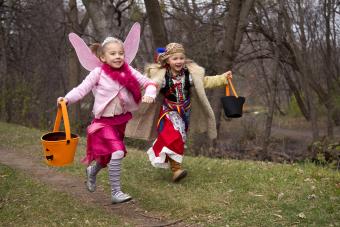 Halloween girls running with DIY treat baskets