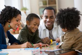 Family playing board game together