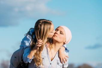 A woman with cancer is next to her daughter