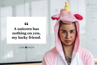 Woman wearing unicorn onesie