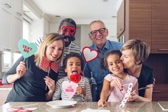 Family doing photobooth portraits on Valentine's Day