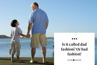 Father and son holding hands on jetty