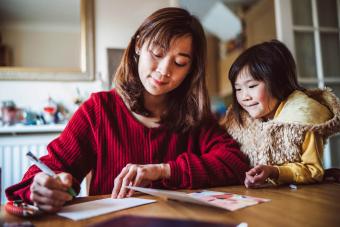 Mom & daughter preparing greeting card