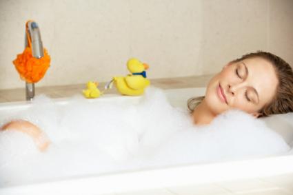 Woman relaxing in bubble bath
