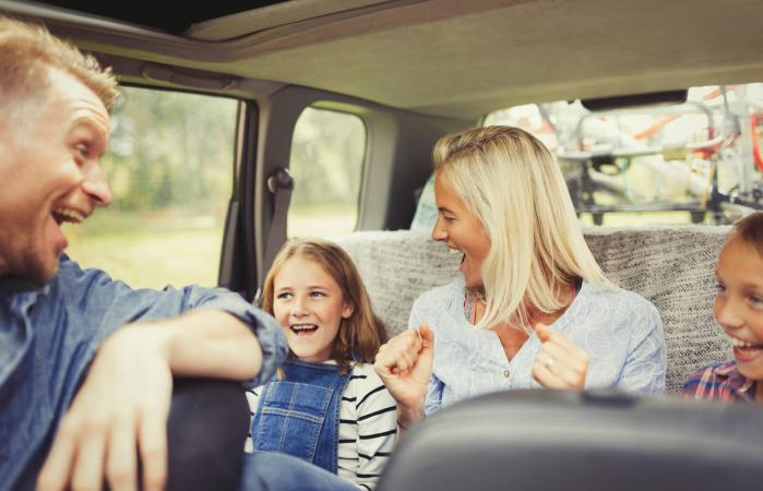 Family in car road tripping