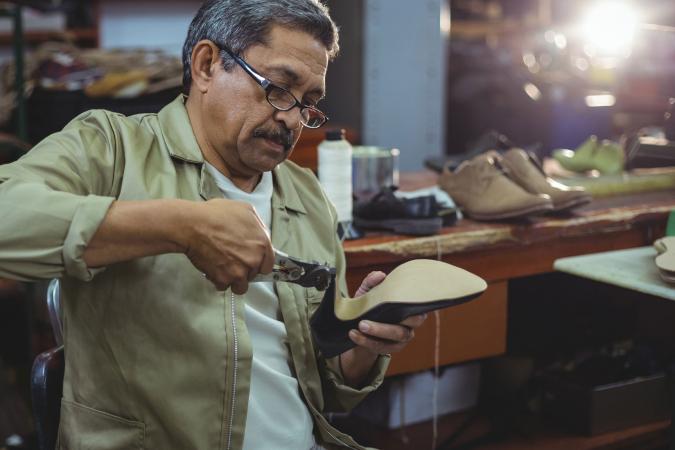 Shoemaker making a shoe