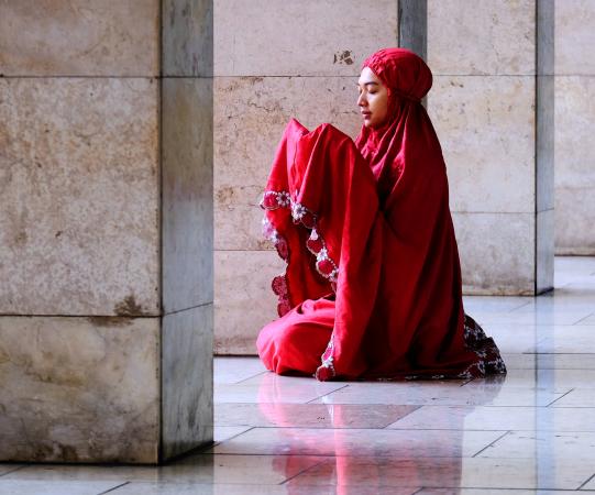 Woman praying in mosque