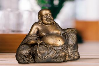 Laughing Buddha statue in the home