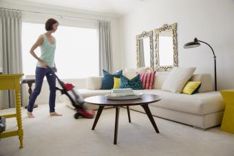 Woman vacuuming her living room