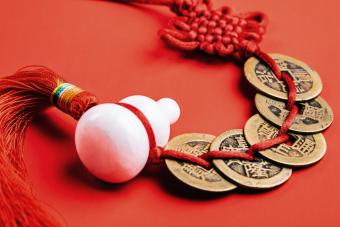 Chinese red knot, jade gourd and bronze coins