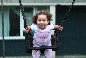 Little girl on swing