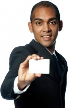 Man holding blank business card.