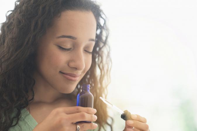 smelling aromatherapy oil