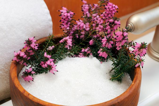 Epsom salt in bowl with heather