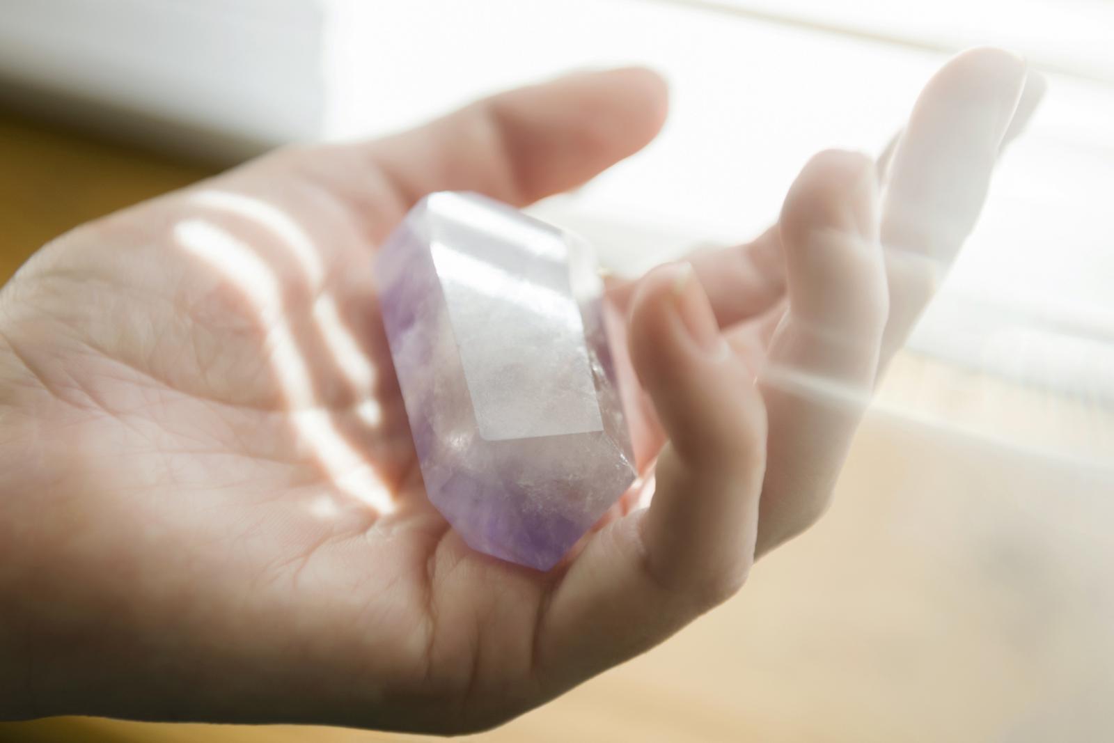 woman holding crystal