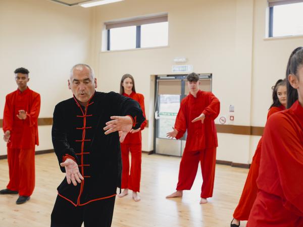 people practicing qigong techniques