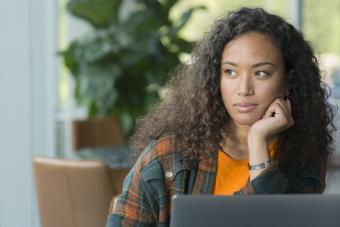 Woman making decisions while looking out of the window 