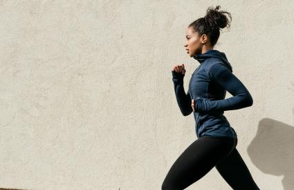 Woman Running Against Wall