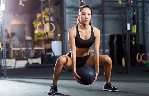 woman exercising with medicine ball