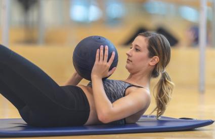 Woman working out alone in the gym