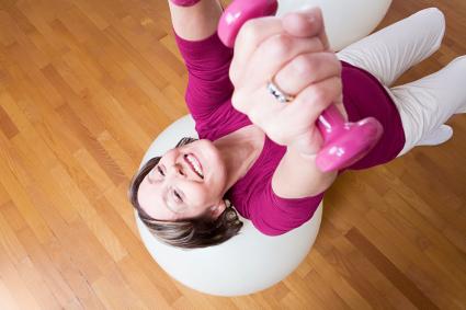 Woman using dumbbells