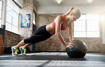 woman doing ball planks