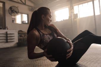 woman using medicine ball