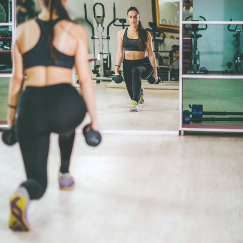 woman working out with dumbbells