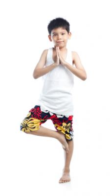 Child doing tree pose