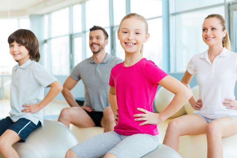children sitting on yoga balls