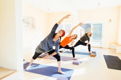 3 women performing lateral lunges