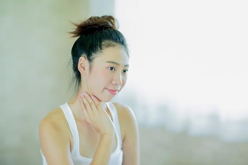 woman massaging her neck