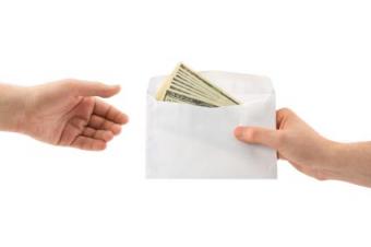 An exchange of a money-filled envelope