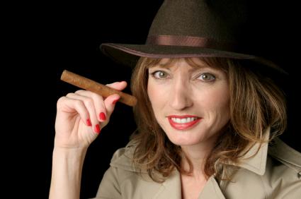 woman in a fedora and trench coat