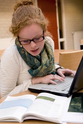 Young female student with laptop