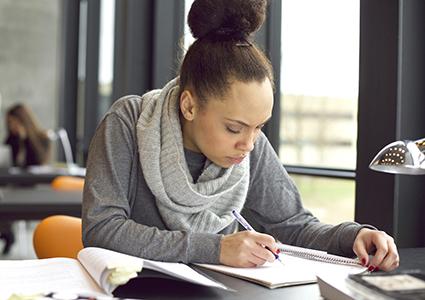 Woman working on research paper