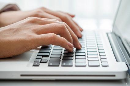 Closeup of typing on computer