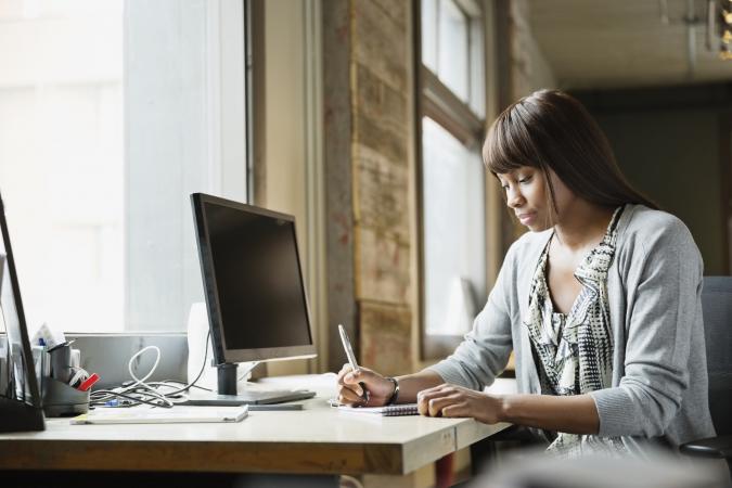 Freelancer working at bright desk space