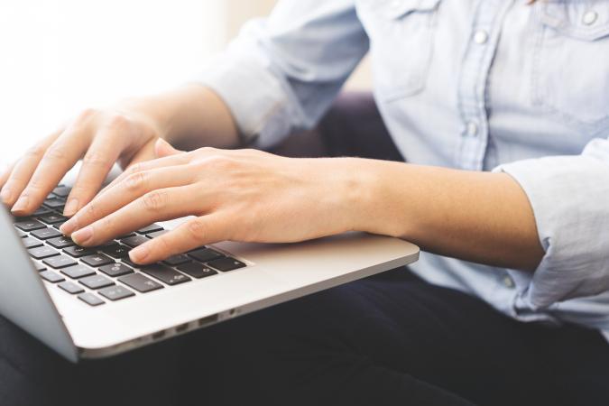 typing on a laptop keyboard