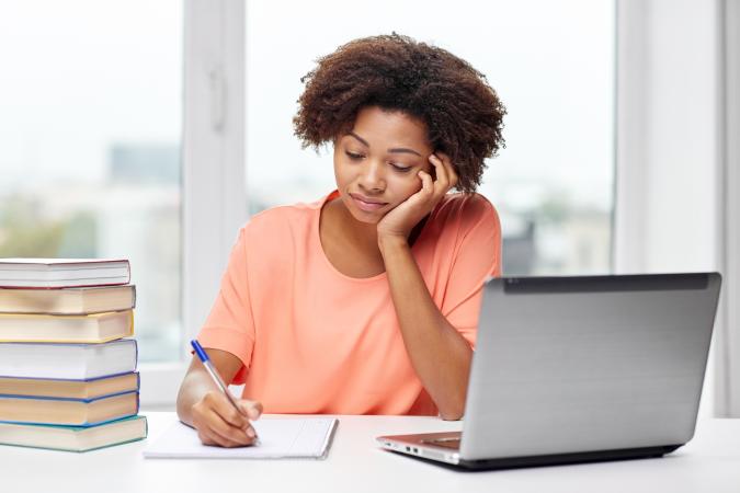 woman writing in notebook