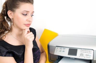 Writer at computer printer
