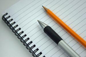 writing pad with pen and pencil